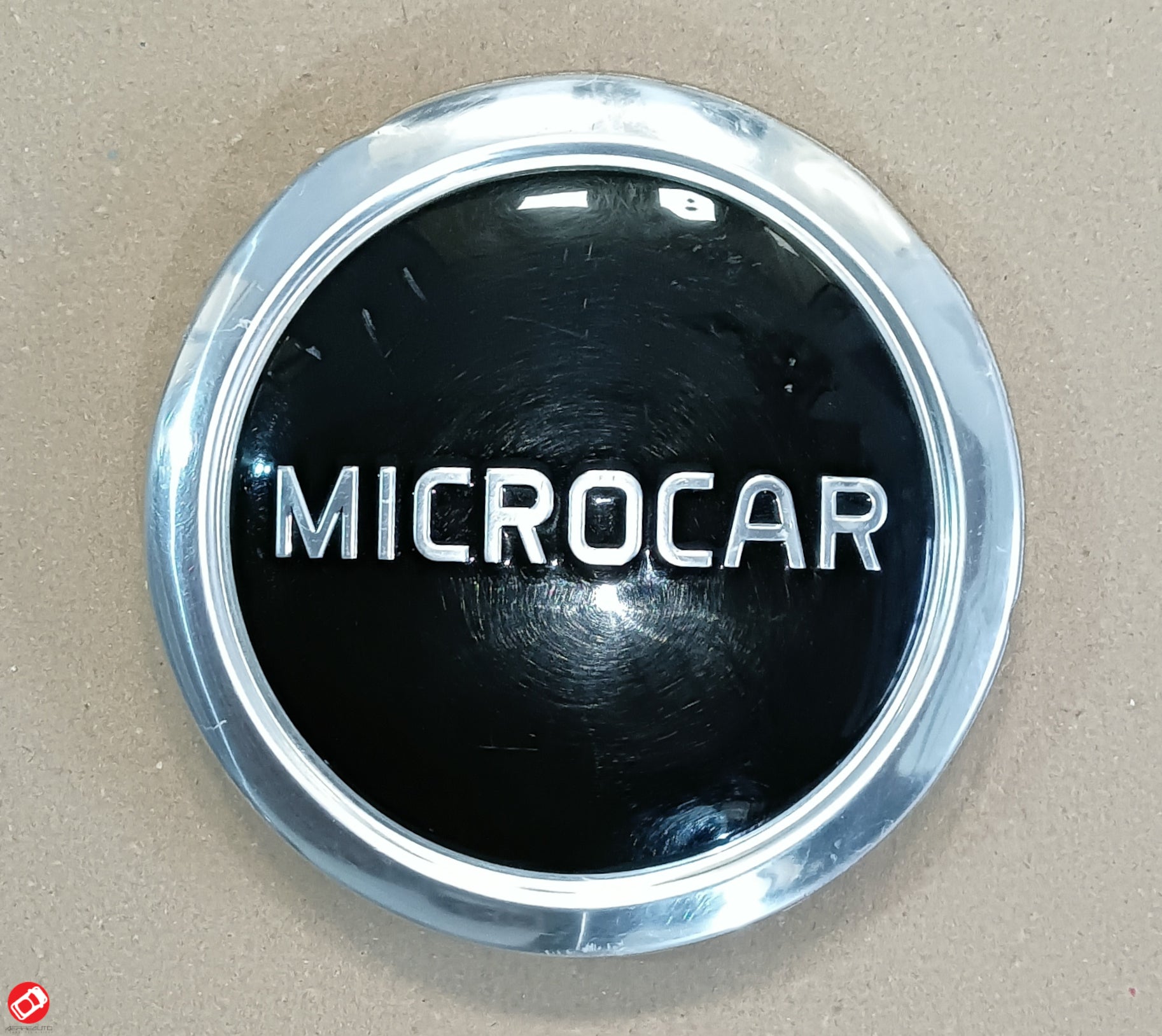 Microcar M8 wheel cover logo